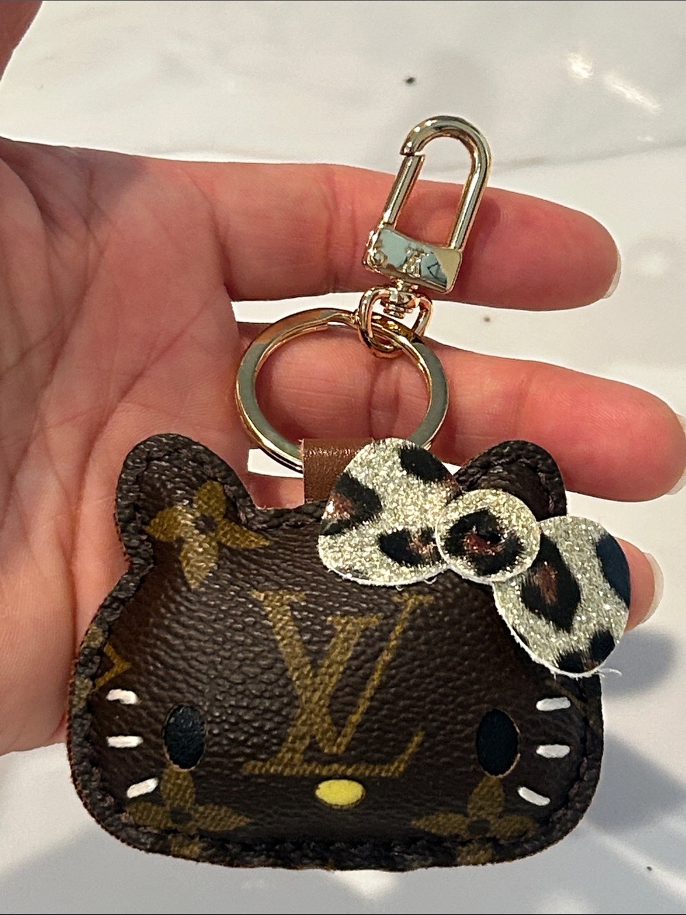 Upcycled LV Gold-Tone Brown Monogram HK Keychain Bag Charm with Leopard Bow